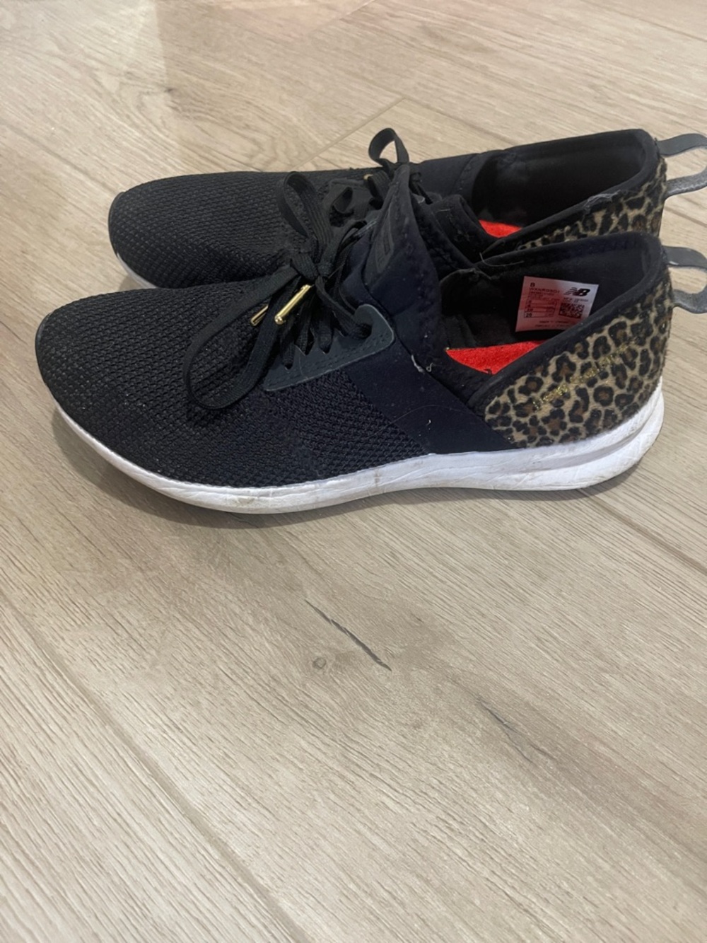 New Balance Black Sneakers with Leopard Heel Accent
